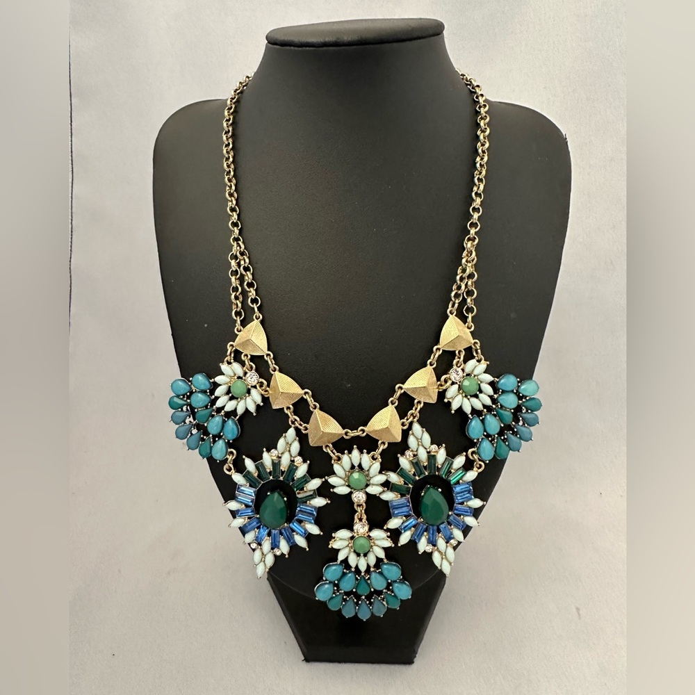 Statement necklace in gold tone with blue and green stones